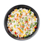 White rice with vegetables in a black bowl isolated on white background